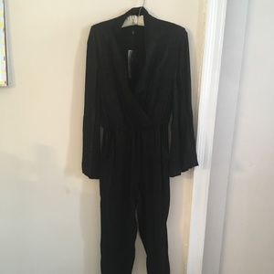 One piece black 1005 rayon jumpsuit.  BRAND NEW
